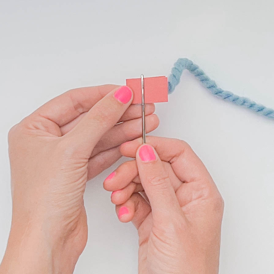 How to thread a yarn needle for knitting - step 4
