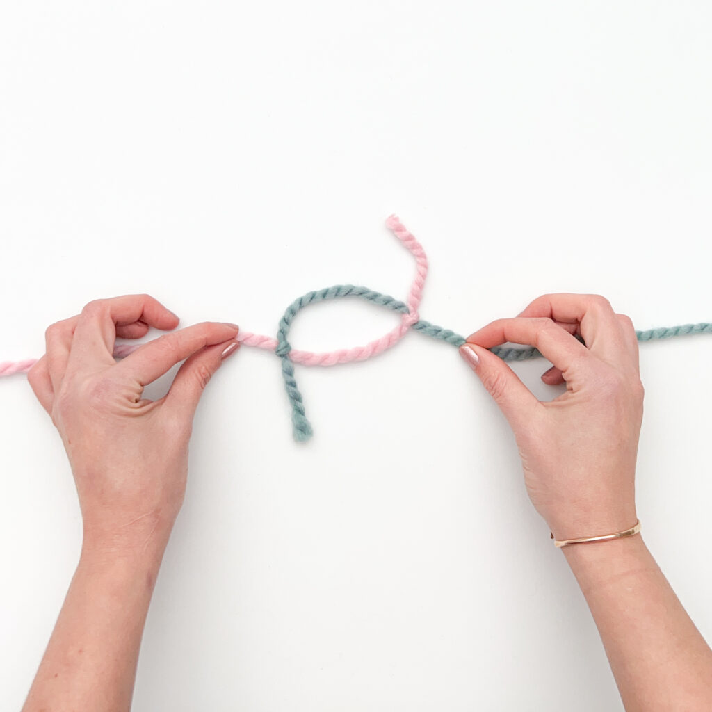 Magic Knot Yarn Join - Cinching the knots together Step A