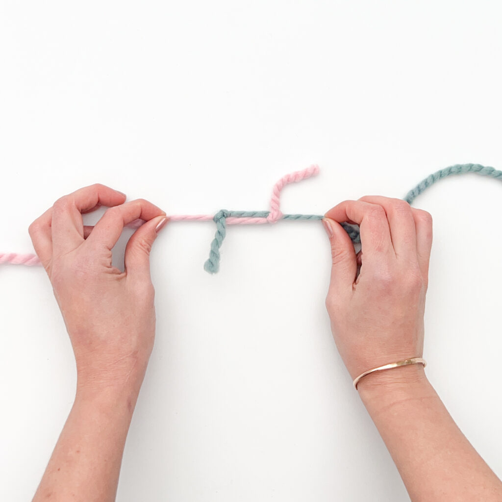 Magic Knot Yarn Join - Cinching the knots together Step B