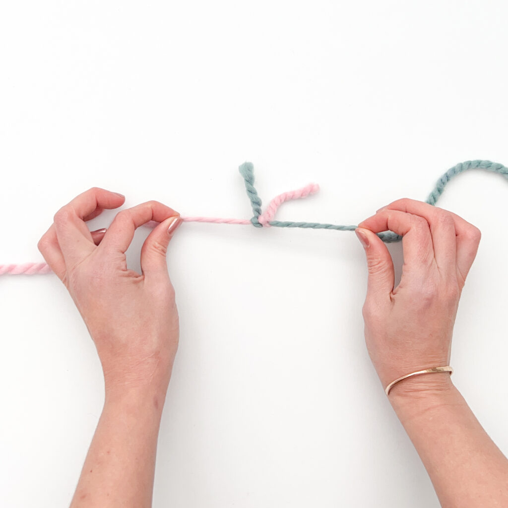 Magic Knot Yarn Join - Cinching the knots together Step C