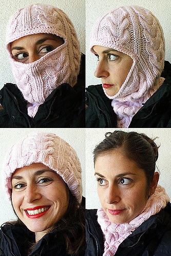 This is an image of a smiling woman wearing the finished "From Russia, With Love" cabled knit balaclava.