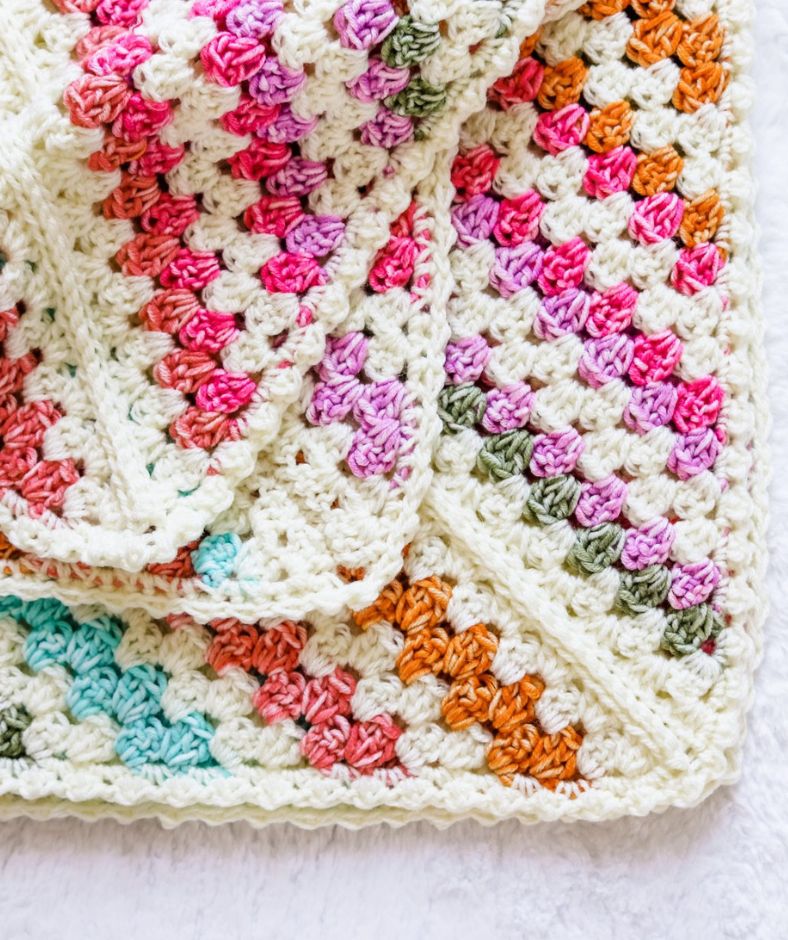 Baby Blanket Crochet Pattern - a folded Daphne Afghan