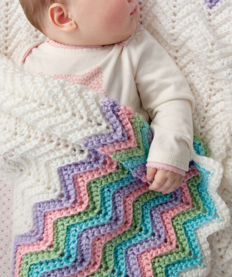 Baby Blanket Crochet Pattern - Rickrack Rainbow Baby Blanket on top of a baby napping