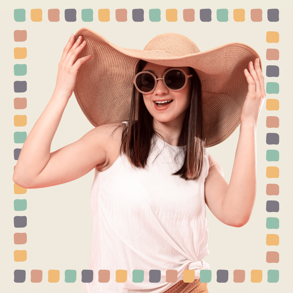 Image of a girl wearing a beach hat and a pair of sunglasses.