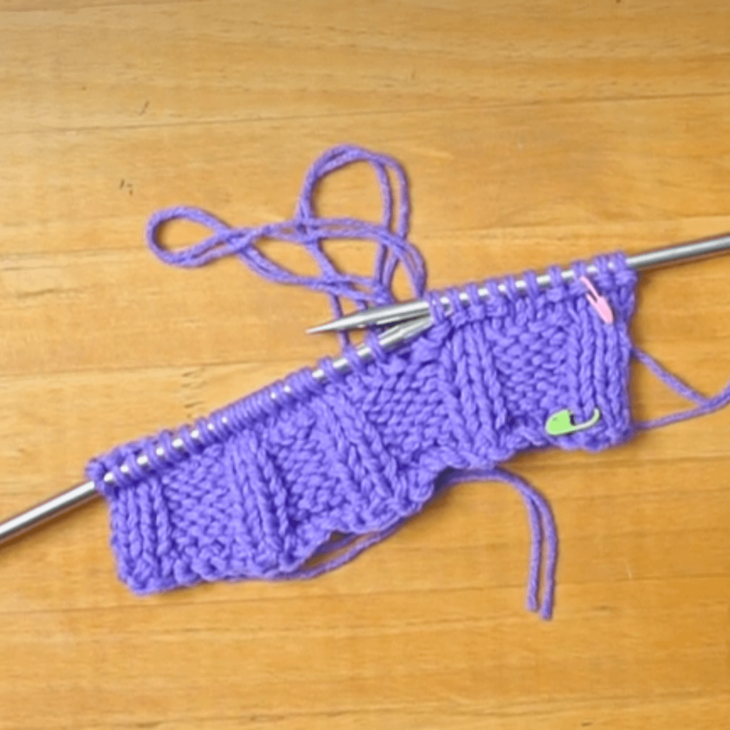 Step 3: P4, K2, PM, [P4, K2] repeat until 3 stitches remain. P4 in the last 4 stitches.

Tip: Place a stitch marker on the very first knit/purl stitch that you make on this row. This will help you with counting!