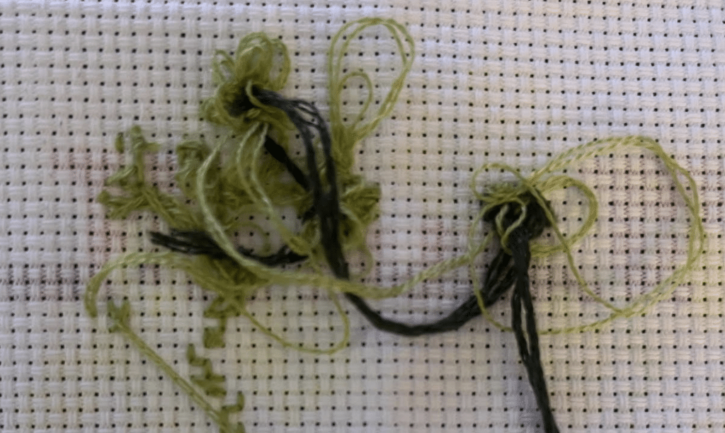 Tangled cross stitching fibers