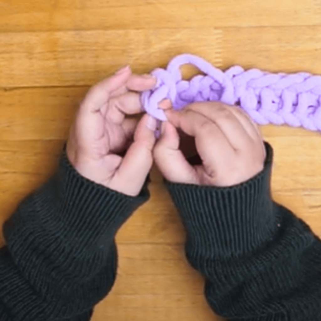 Take that new loop and move to your pinky finger and knit.