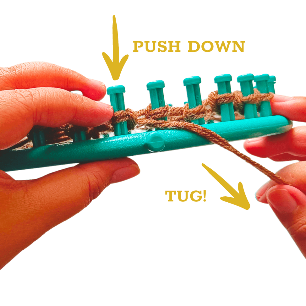 Push the loop down onto the peg. Tug the yarn downwards to tighten the loop on your peg. 
