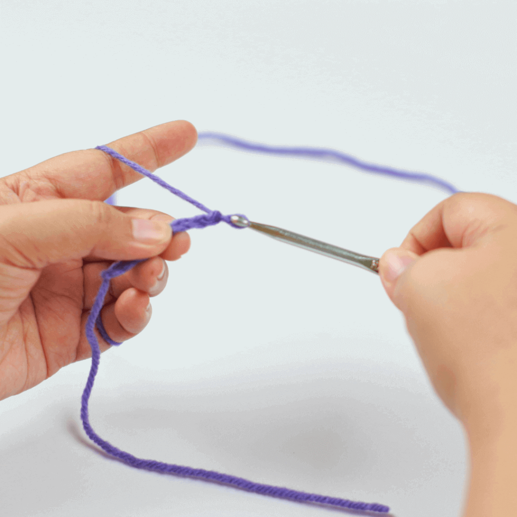 Step 3: Pull Through

Once you grab your yarn, pull it through the loop.