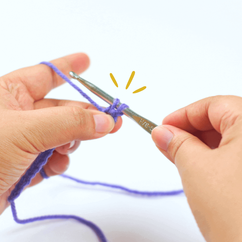 Hold onto the end of the chain stitch you are working on to make it easier to pull your loop through.

Pro tip: Make sure your hook is facing towards you to have an easier time grabbing a loop.