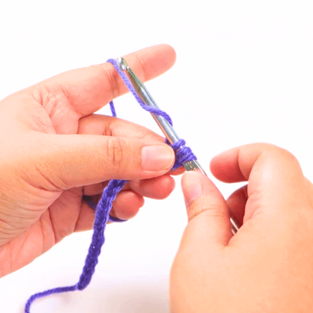 Step 3: Yarn over

Go from under your working yarn and over, grabbing a loop using your hook.