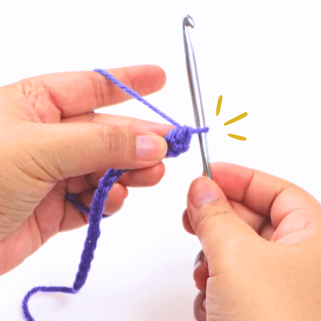 Step 6: Go through the last 2 loops on your hook

Now you have your first double crochet!