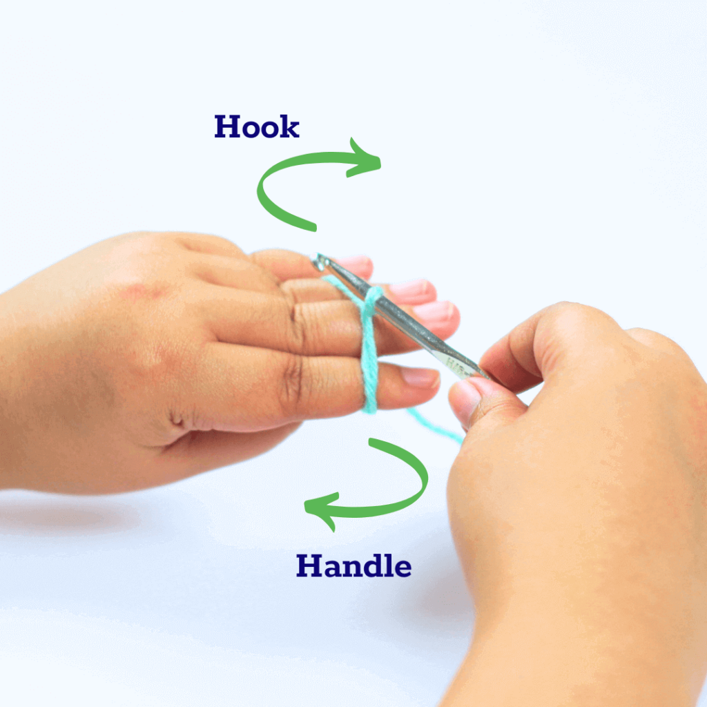 Rotate your hook away from you. This will make a small twist, forming a loop.