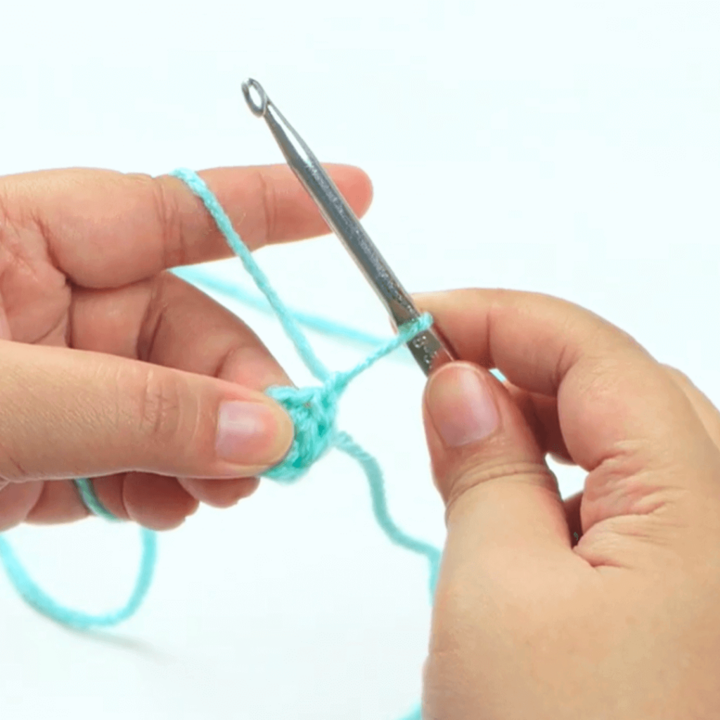 YOUR FIRST SLIP STITCH

By the end, you should have a crochet slip stitch that looks like this! Now you can use it to connect the ends of your crocheted rows together.