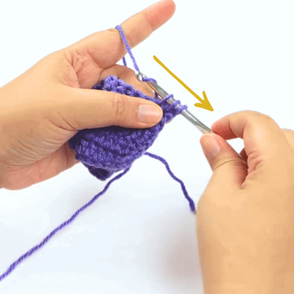 Step 3: Go through the 2 front loops

Yarn over once and go through the first 2 loops on your crochet hook.