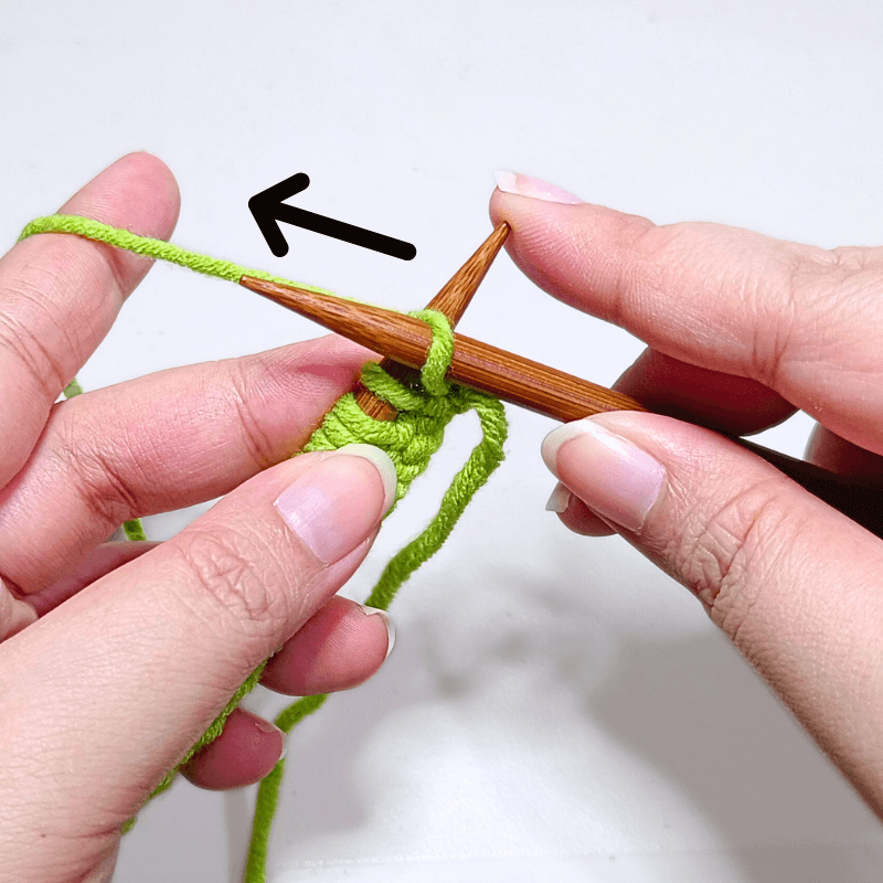 Hold the yarn towards the back
