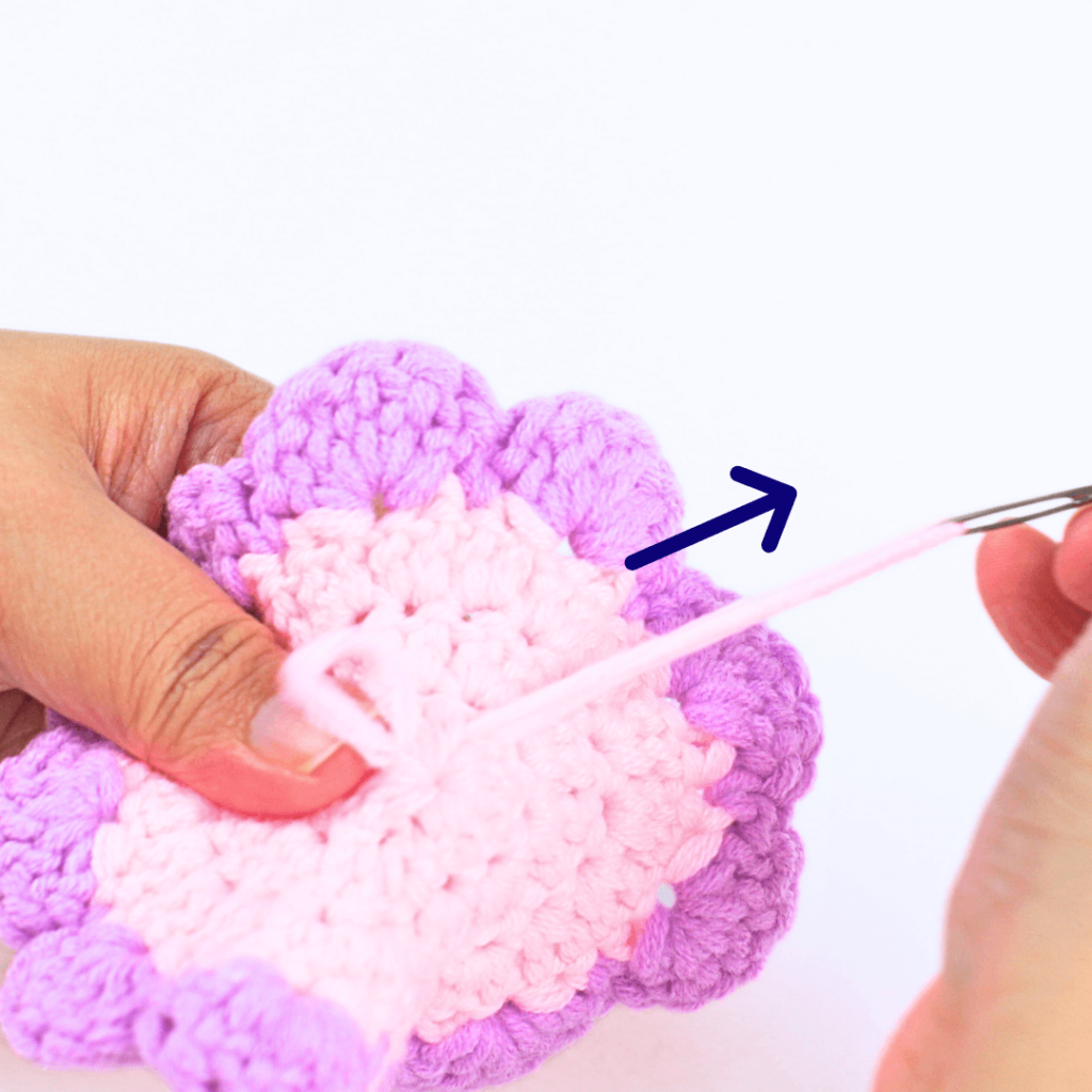 Hide the yarn tail in the middle of the flower by weaving it through the magic ring. Part 2. Finish.
