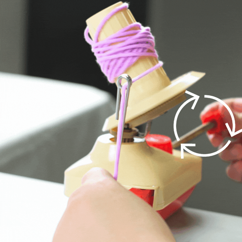 Step 3

Crank the handle to start spinning your skein into a cake.

You can hold onto the working end of the yarn to even out the tension on your yarn cake.

Keep cranking to spin the winder until your yarn winder’s spool is full or you run out of yarn to spin.