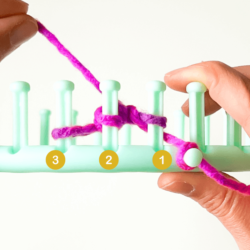 Now you have one loop on each peg.