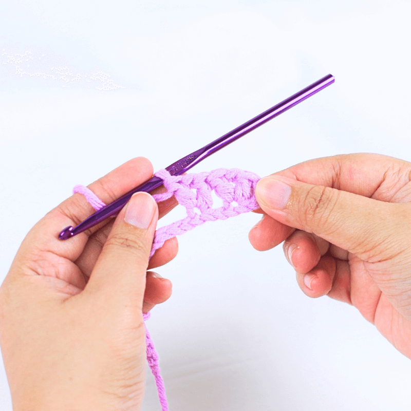 Step 3

*Skip 2 chains, [dc, ch 1, dc in the same stitch]*, repeat * * until the end of the row. Make 1 dc in the very last stitch.

Reminder: 

Everything inside the two [ ] should be made inside the same stitch

Everything inside the two * * should be repeated until the end of the chain