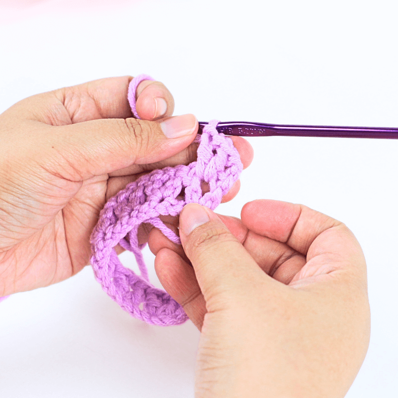 Go straight into the Ch 1 space or the previous row's "V" stitch, [dc, ch 1, dc] inside the ch sp. *Go right into the next ch sp, [dc, ch 1, dc]*, repeat * * until the end of the row.

Reminder: "Ch sp" means "chain space" in this pattern.