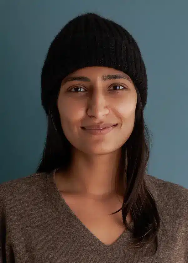 A beautiful woman wearing a black knit beanie 