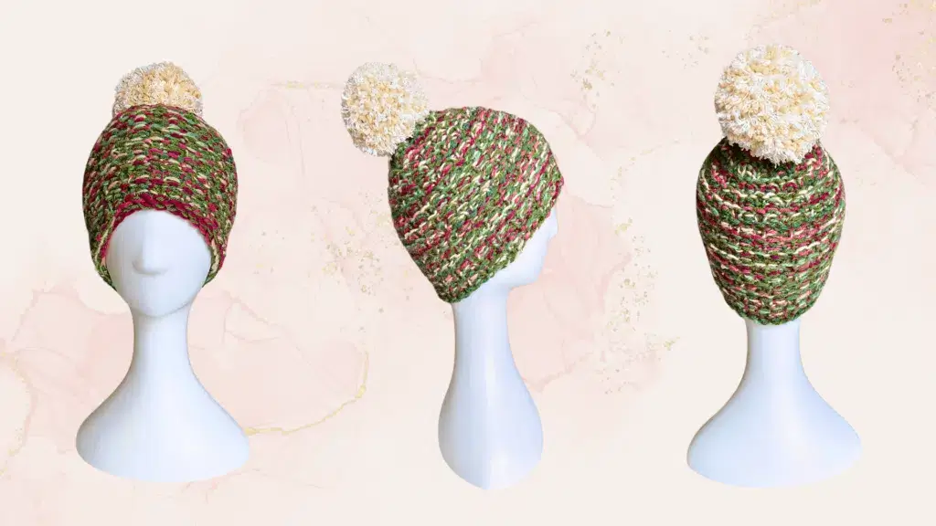A loom knit beanie made with colorful yarn that looks like a mixed berry bush.