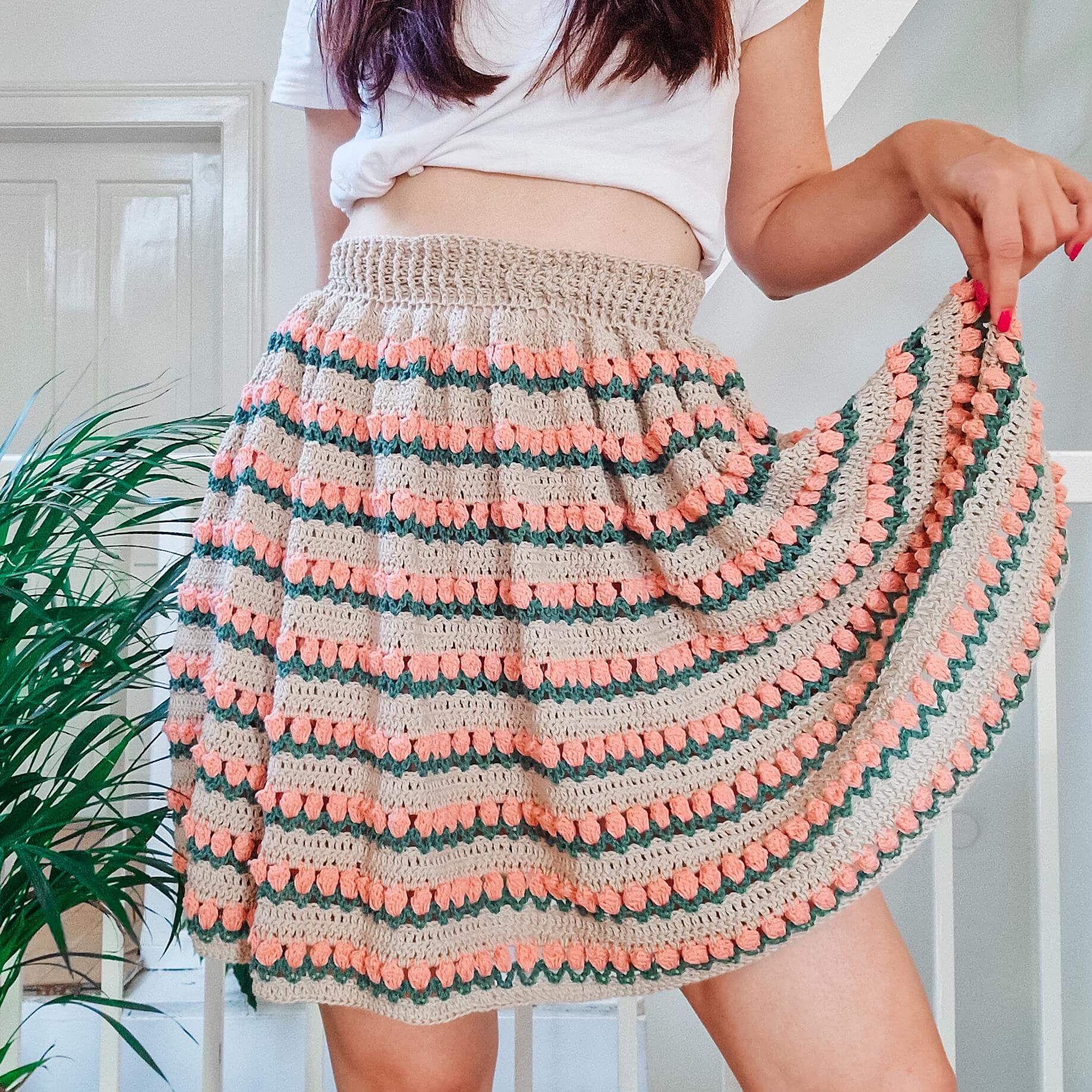 A cute crochet skirt pattern that looks like rosebuds all over the fabric.